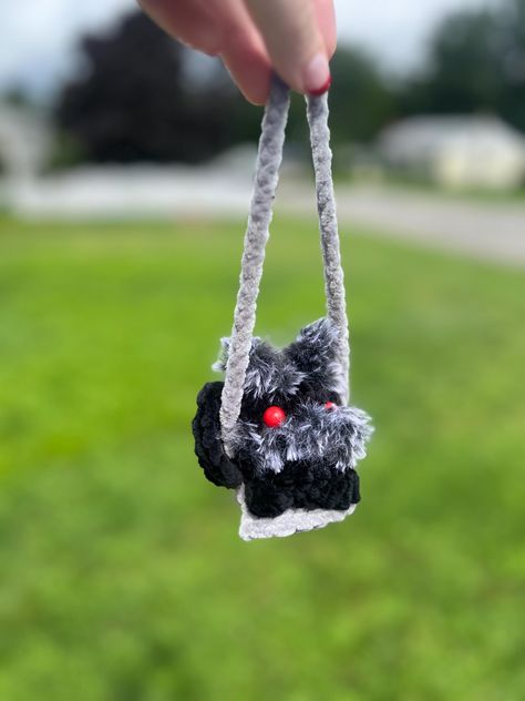 Cryptid on a swing. Pattern by close.knit.crochet The cryptid is about 2.5in in height and the overall plushie with swing is about 8in Each item is handmade so there may be variations in each one. Plastic safety eyes have a backing on them so they should not be able to come out easily but still be mindful around small children and pets Cryptid Crochet Pattern, Crochet Cryptid, Cryptid Crochet, White Cowboy Hat, Rear View Mirror Decor, Scary Dolls, Crochet Inspiration, Miniature Gift, Safety Eyes