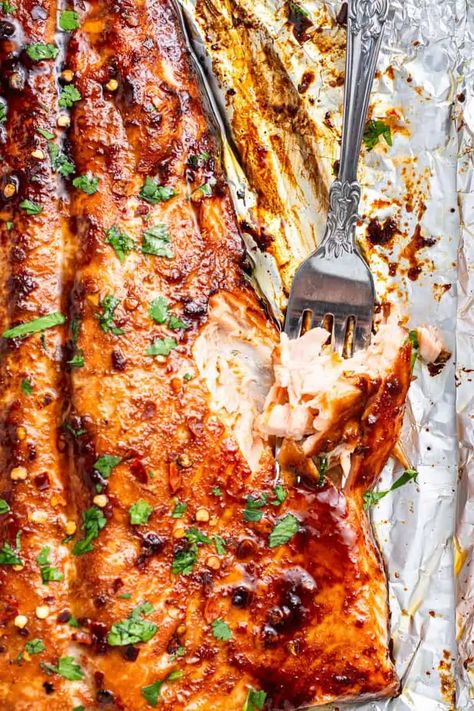 close up on flaking firecracker salmon with a fork Spicy Salmon Recipes, Firecracker Salmon Recipes, Firecracker Salmon, Protein Dinners, Salmon Recipes Oven, Dinner Salmon, Salmon Salad Recipes, Oven Baked Salmon, Foods To Try