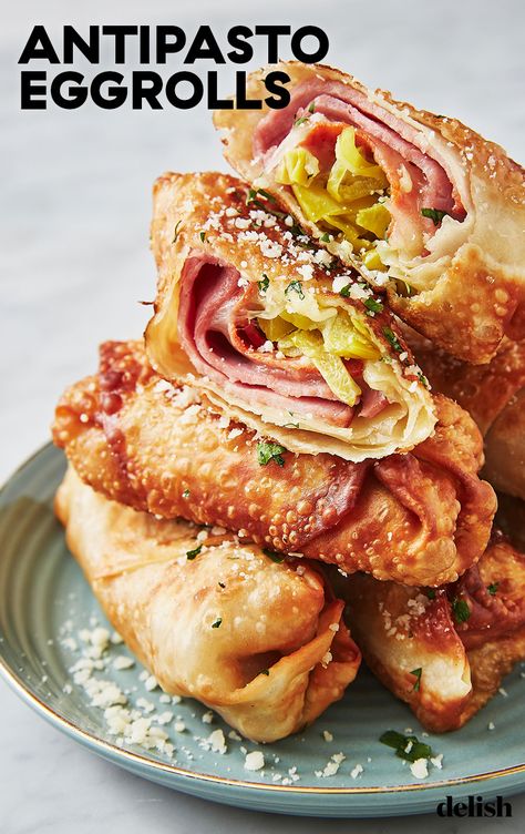 If you loved our Antipasto Squares, just WAIT 'til you try these Antipasto Egg Rolls. Get the recipe at Delish.com. #recipe #easy #easyrecipes #delish #antipasto #eggrolls #cheese #mozzarella #ham #pepperoni #app #appetizer #party #partyfood #italian #pepperoncini #partyideas Southwestern Egg Rolls, Cheesy Ham, Pasta Fillo, Pickle Recipe, Fingerfood Party, Egg Roll Wrappers, Egg Roll Recipes, Cheesy Bread, Great Appetizers