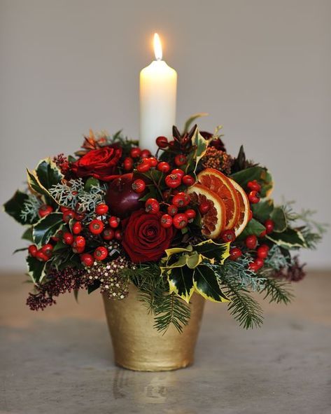 LOVE HOMEDIT? FOLLOW US 15k 1.1m 329k 9k 6.3k Sign up for our newsletter Christmas Centre Pieces, Art Floral Noel, Xmas Flowers, Christmas Floral Designs, Christmas Flower Decorations, Gubahan Bunga, Candle Arrangements, Christmas Centers, Deco Table Noel