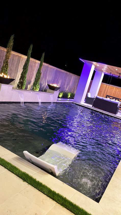 Backyard Inspo Backyard Goals HGTV Backyards Pool Lights Cabana Swing Waterfall Tanning Chairs Backyard Lights Outdoor Seating Pool Fountains Waterfall, Backyard Pool Landscaping Night Lights, Neon Signs For Pool Area, Nice Pools, Pool With Lights At Night, Backyard Pool Aesthetic Night, Nice Backyard, Stairs Black, Backyard Lights