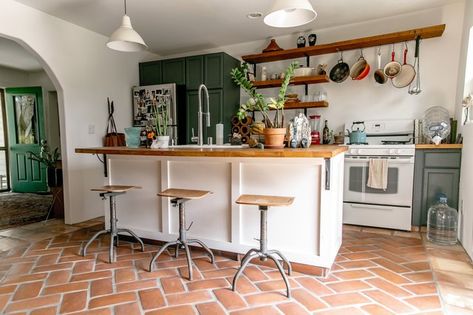 This Charming Home Is a Nod to Simplicity, Right Down to the Artwork | Hunker Spanish Farmhouse, Kitchen Color Trends, Tudor Kitchen, Herringbone Kitchen, Kitchen Floor Tiles Ideas, Saltillo Tile, London Houses, Rustic Kitchen Cabinets, Bohemian Kitchen