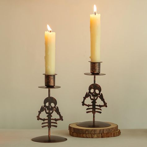 PRICES MAY VARY. Vivid and Adorable Skulls - Embrace the Halloween spirit with these lively and cute candle sticks holder decor, This skeleton stand blends perfectly with the candlestick holder, ideal for enhancing your Halloween decor with a touch of whimsical and playful charm Black with Orange Antiqued Finish - The black candlestick holders with orange antiquing bring a unique Halloween atmosphere to your space, infusing it with a festive vibe that's both striking and eye-catching. Let this H