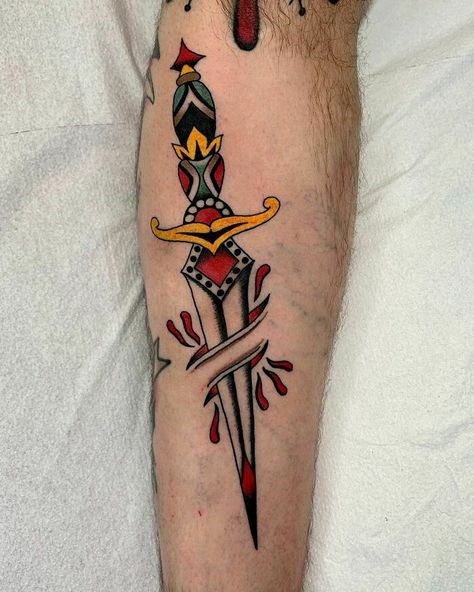 American Traditional Classic Dagger Arm Tattoo Dagger Through Skin Tattoo, Dagger Arm Tattoo, Colored Traditional Tattoo, American Traditional Ship Tattoo, American Traditional Dagger Tattoo, American Traditional Dagger, Which Tattoos, Dagger Tattoo Traditional, Traditional Mermaid Tattoos