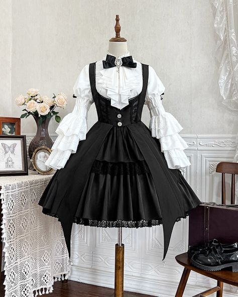 It's the season of little witches everywhere! 🧙‍♀️ New black witch JSK paired with a white princess-sleeved bib blouse—only $99.50! Search "XDJ-154" on devilinspired.com to shop now! 🎃 #witchseason #witchlolita #lolitafashion #spookyvibes #jumperskirt #lolitajsk Witch Cute Costume, Spooky Cute Outfits, Witch Goth Outfits, Goth Lolitas, Lolita Outfit, Gothic Skirts, Witch Dress, Bell Sleeve Shirt, Long Bell Sleeves