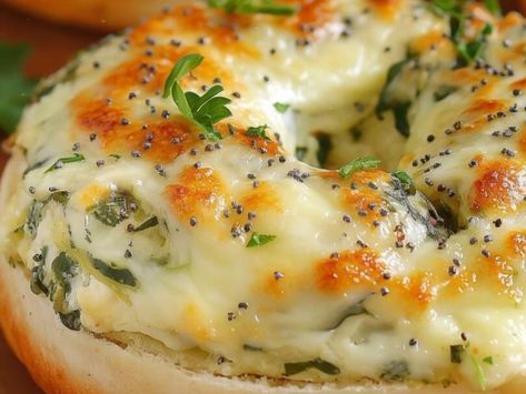 A Cheesy Breakfast Dream: Spinach-Artichoke Bagels Recipe That Hits the Spot! - NewsBreak Spinach Bagel, Spinach Artichoke Cheese Bread, Cheesy Spinach Artichoke Bagels, Cheesy Spinach Artichoke Bread Bowl Dip, Spinach Artichoke Dip In Bread Bowl, French Onion Meatballs Recipe, Italian Orzo, Chicken Primavera Pasta, Homemade Caramel Candy