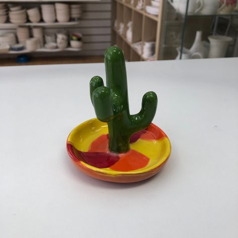 NEW STOCK ALERT! This is the first of our new Cactus Ring Holders that we've had painted and it looks great! Don't be prickly and book to come and say hello to us in the studio today! www.mycraftymonkey.com/bookings #potterypainting #pyop #craftstudiocambridgeshire #cactuspottery #ringholder Clay Cactus Ring Holder, Cactus Ring Holder, Cactus Pottery, Clay Cactus, Cactus Ring, Ring Holders, Pottery Crafts, Painting Studio, Craft Studio