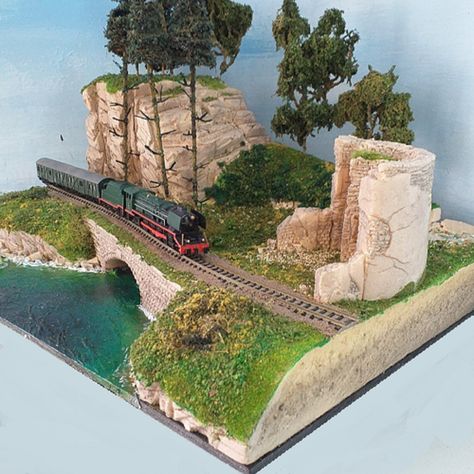 This scenic model landscape diorama is handmade to order, When completed, and before shipping, I will send you photos for your approval.  This model diorama is perfect for displaying your  model trains in N scale 1/160 Standard base size of 42 x 30 cms (16.5 x 11.8 inches).  Small adjustments can be made before I start making your diorama, like tree heights, type of castle ruin, etc. I take great care to details, and realism, just send me a message with your requirements and scale size of your m Train Diorama, Model Train Display, Model Landscape, Mini Landscape, Model Diorama, N Scale Model Trains, Miniature Landscape, Train Miniature, Landscape Model