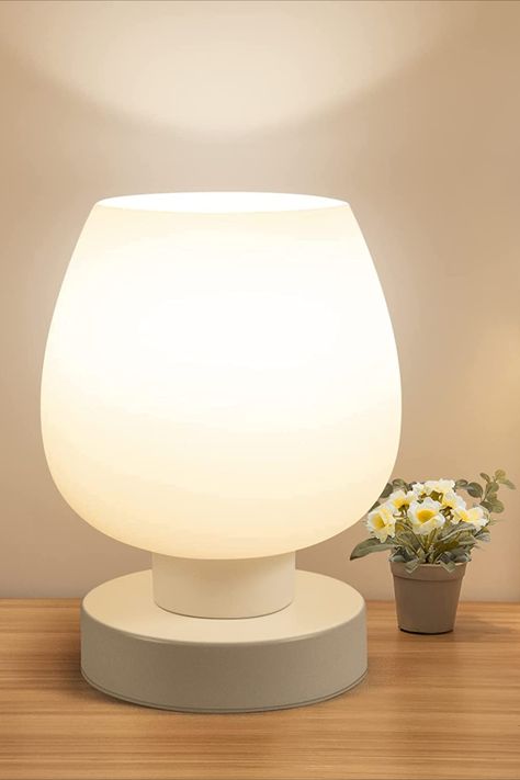 The Amazon Touch Bedside Table Lamp is a modern and elegant lamp designed for bedrooms, living rooms, nightstands, and desks. It features a white opal glass lamp shade that diffuses warm LED light, creating a cozy and inviting atmosphere. The lamp is also 3-way dimmable, allowing you to adjust the brightness according to your preference. #bedroomdecor #homedecor #interiordesign #nightstand #tablelamp #mothersdaygifts #giftideas #minimalist #affiliatedprogram Room Nightstand, Minimalist Nightstand, Nightstand Desk, Elegant Lamp, Minimalist House, Bedside Table Lamp, Small Lamp, Nightstand Lamp, Lamp For Bedroom