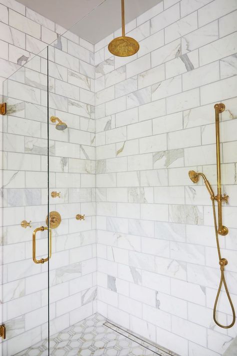 Marble zero entry shower with linear drain and stone inlay Calcutta Gold Marble Bathroom, Brick Tile Backsplash, Marble Shower Walls, Calcutta Gold Marble, Ceiling Paint Colors, Calcutta Gold, Beveled Subway Tile, Blue Glass Tile, Calcutta Marble