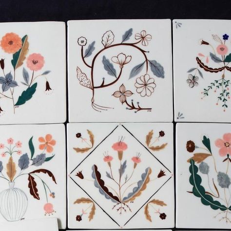 Flora Waycott on Instagram: "Last year I made this collection of hand painted ceramic tiles with the help of my dear friend @winterwares , who kindly spent her day off giving me some much needed tile making guidance and making me lots of tea 🤍✨ I have been a little unsure as to what to do with these tiles - I wanted to sell them separately as decorative pieces of art but now I feel like they belong together as a collection and should stay together? So I think I will keep these for myself, to decorate in my home. Maybe I’ll make more? or fewer pieces in a collection? I’ll be making some small batches of hand painted ceramics (and perhaps more tiles) this year to sell online so please sign up to my newsletter if you would like to be notified ✨🌿" Hand Painted Ceramic Tiles, Flora Waycott, Ceramic Tile Crafts, Tile Making, Tile Painting, Painted Ceramics, Painting Ceramic Tiles, Tile Crafts, Hand Painted Tiles