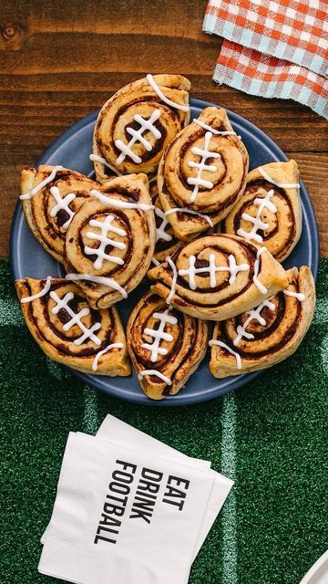 Maegan Brown ~ The BakerMama on Instagram: "Kick-off game day with Football-Shaped Cinnamon Rolls! 😋🏈🙌 You’ll score big with the home team with these delicious breakfast treats. HOW-TO BELOW ⬇️ and in the Tailgate Brunch Spread from my Spectacular Spreads Cookbook! 🏆 #TheBakerMama #SpectacularSpreadsCookbook  FOOTBALL-SHAPED CINNAMON ROLLS  Ingredients: 🏈 1 (17.5-ounce/5-count) can jumbo cinnamon rolls with icing  Instructions: 1. Preheat the oven to 350°F. Place each cinnamon roll on a baking sheet and firmly form each one into an oval football shape by pinching the sides. 2. Bake for 8 minutes, take the cinnamon rolls out of the oven, and reinforce the footballs shape with tongs or your fingers. 3. Return the cinnamon rolls to the oven, and bake for about 8 more minutes, or until go Jumbo Cinnamon Rolls, Cinnamon Rolls With Icing, Shaped Cinnamon Rolls, Football Shaped Foods, Brunch Party Recipes, Brunch Spread, Football Food, Brunch Party, Breakfast Treats