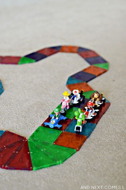 Building a rainbow road out of Magna-Tiles, inspired by the game Mario Kart from And Next Comes L Mario Kart Activities, Rainbow Road Mario Kart Decorations, Teach Boxes, Mario Kart Rainbow Road, Mario Ideas, Rainbow Road Mario Kart, Mario Day, Magnet Tiles, Mario Crafts