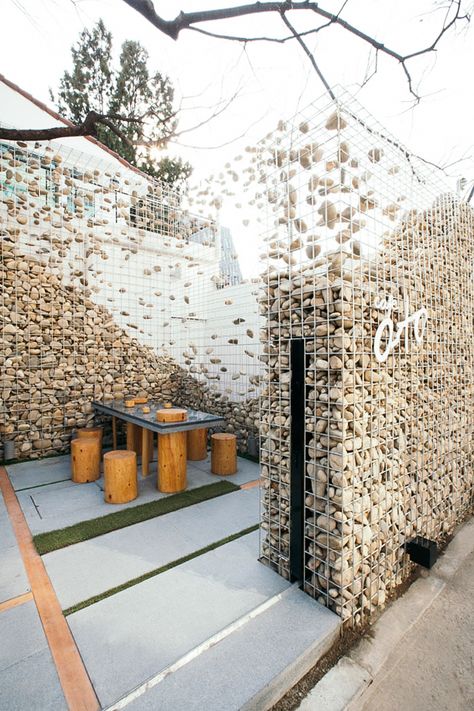 Photo: Design Bono Café Design, Gabion Wall, Retail Design Blog, Design Exterior, Cafe Design, Outdoor Design, Stone Wall, Retail Design, House Stuff