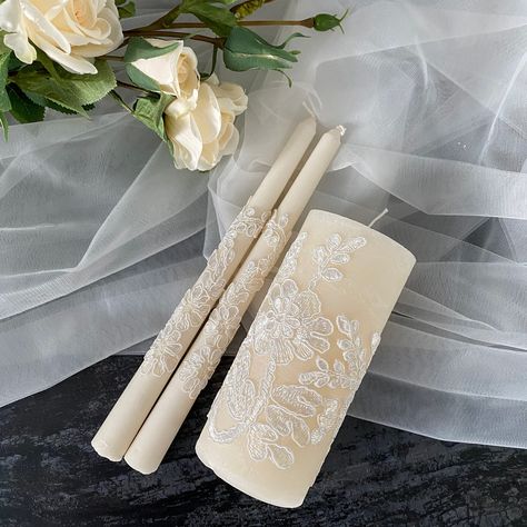 Shop beautiful creamy Lace Unity Candle Set with lace and personalize them with your names and wedding date. A stylish candle design will decorate the wedding ceremony. Wedding Unity Candle Set for your champagne (beige) wedding. Personalization on Tall candle is available. Select your set of candles in the drop-down menu. MEASUREMENTS: Medium pillar candle - 5,9 inch (15 cm) and diameter - 2,8 inch (7 cm) Tall pillar candle - 7,9 inch (20 cm) and diameter - 2,8 inch (7 cm) Height tapers - 9 inc Candle For Wedding Ceremony, Unity Candles Wedding, Wedding Essentials Set, Wedding Candles Ceremony, Unity Candle Ideas, Wedding Personalization, Filipiniana Wedding Theme, Bridal Candles, Candle Ceremony