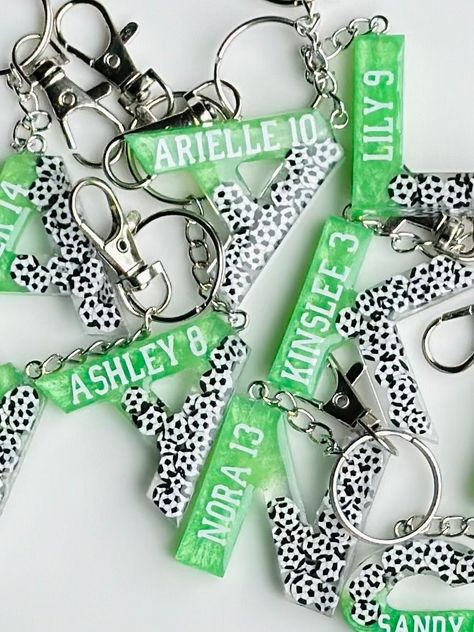 "⚽️ These unique keychains are handcrafted by setting soccer ball glitter and mica powder in crystal clear resin.  ⚽️  It is the perfect personalized gift for your soccer team and friends! Just choose the initial, and let us know  in the personalization box the name and number you want inside the keychain! ⚽️ A great accessory to attach to backpack, handbag, shoulder bag, bags, purse and wallet. ⚽️ Packaging: Each piece of jewelry will come as pictured. Note: All letters are uppercase. The uppercase letter \"i\" keychain is NOT a line with two small lines above and below, it is just a straight line. Thank you for visiting our shop. -------------------------------------------------------------------------------------- Floral Keychain | Botanical gift | Floral Gift | Personalized Gift | Gift Soccer Resin Art, Wallet Packaging, Friends Backpack, Keychain With Name, Floral Keychain, Resin Bookmarks, Letter Keychain, Initial Keychain, Bookclub Gifts