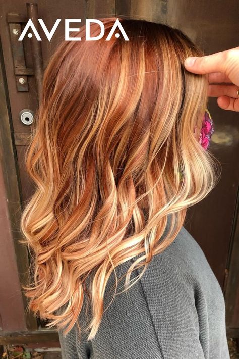 Adding a copper twist to your summer balayage is a great way to transition your hair for the fall season. These warm red and copper tones are reminiscent of our favorite colors of autumn. Click to find an Aveda Salon near you to achieve your own autumn hairstyle. Aveda Artist @shauna_planethair #CopperBalayage #FallHairColor #RedHair #WavyHair #CopperHair #MediumLengthHairstyles Dark Auburn Hair With Blonde Balayage, Red Bayalage Hair With Money Piece, Half And Half Hair Color Underneath Red, Cooper Red With Blonde Highlights, Red Hair With Blonde Balayage Ombre, Red Hair With Blonde Highlights Money Piece, Blonde Hair With Copper Highlights Low Lights, Root Smudge Strawberry Blonde, Blond Copper Highlights