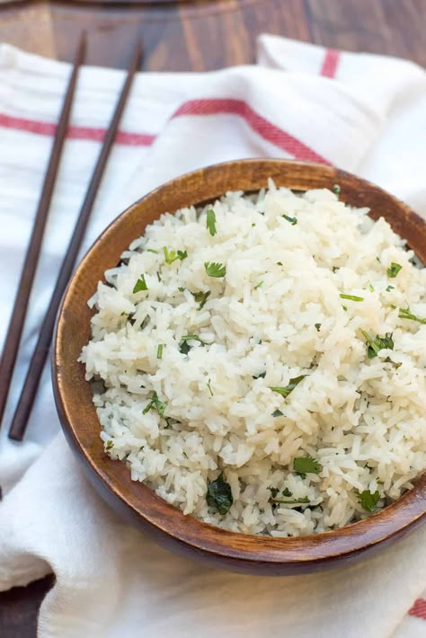 Add some interest to your next Asian or Indian-inspired entree and serve it with Coconut Rice with Cilantro and Lime. Your taste buds will thank you. #rice #coconutrice #coconutmilk #sidedish Rice With Cilantro And Lime, Rice With Cilantro, Jasmine Rice Recipe, Best Sushi Rice, Indian Entree, Coconut Jasmine Rice, Chipotle Rice, Panang Curry Recipe, Jasmine Rice Recipes