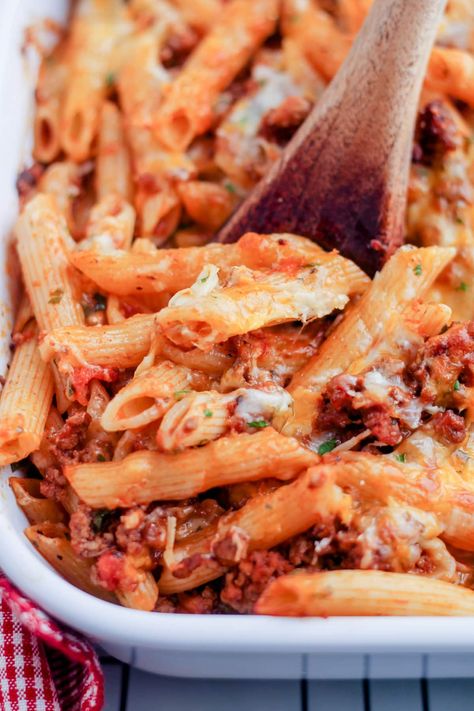 This comforting baked penne pasta is a cheesy classic casserole with ground beef, marinara sauce and of course cheese. This simple pasta casserole recipe is budget-friendly and a popular family dinner. Easy to make and great to reheat for leftovers too! Pasta Bakes With Ground Beef, Baked Penne With Ground Beef, Pasta With Hamburger, Penne Pasta Bake, Casserole With Ground Beef, Baked Penne Pasta, Ground Beef Pasta Recipes, Pasta Marinara, Beef Pasta Recipes