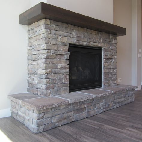 Fireplace Mantels Wrap Around, Short Stone Fireplace, Wrap Around Hearth Fireplace, Fireplace Raised Hearth Ideas, Wrap Around Wood Mantle, Fireplace Wrap Around Mantle, Wrap Around Mantel Fireplace, Fireplace With Wrap Around Hearth, Gray Rock Fireplace