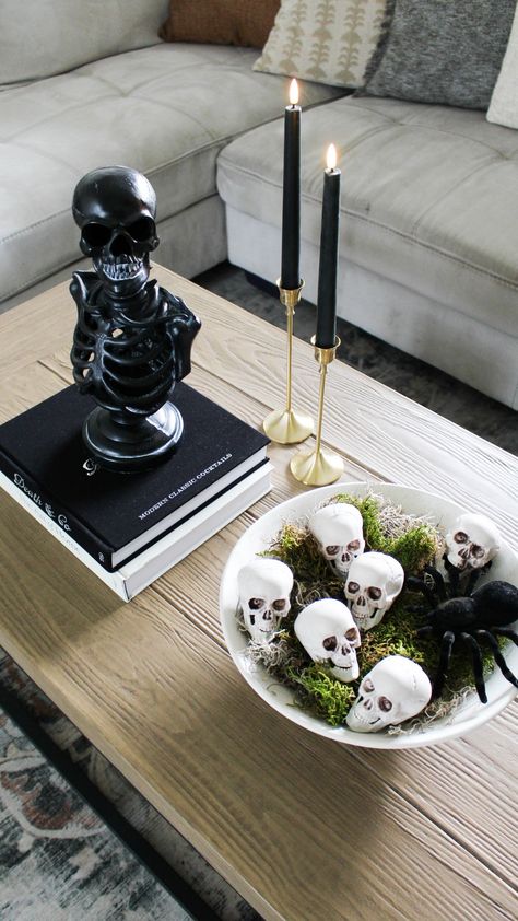 Skeleton decor. Skulls bowl filler. Spider decor. Goth Coffee Table Decor, Witchy Coffee Table Decor, Classy Halloween Table Decor, Halloween Decor Centerpiece, Black Led Candles, Halloween Decor For Coffee Table, Cb2 Halloween, Easy Halloween Centerpieces For Table, Halloween End Table Decor