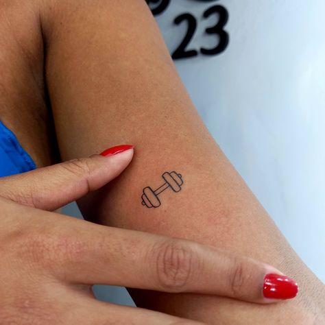 Mini Barbell Tattoo, Dumbbell Tattoo Design For Women, Tattoo Fitness Women, Gym Inspired Tattoos, Gym Rat Tattoo Ideas, Small Gym Tattoos, Gym Tatoos Ideas, Weightlifting Tattoos For Women, Dumbbell Tattoo Design