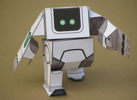 Here's another cute little robot toy for you to build! Sweet Robo is just one piece of paper, and uses new "single piece" flat ax... Robot Papercraft, Pumpkin Templates Free, Paper Robot, Robot Craft, Origami Shapes, Bad Robot, Lego Sculptures, Pumpkin Template, Cardboard Toys