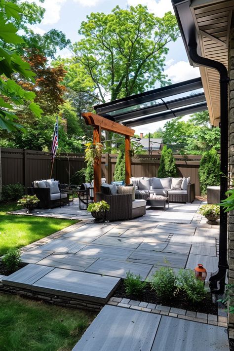 Outdoor living at its best: a small backyard patio with comfortable seating, lush greenery, and elegant landscaping. Backyard Makeover Inspiration. Modern Minimal Outdoor Patio, Backyard Extended Patio Ideas, Extended Patio Ideas, Extending Patio, Diy Outdoor Lighting, Budget Patio, Black House Exterior, Outdoor Patio Designs, Backyard Remodel