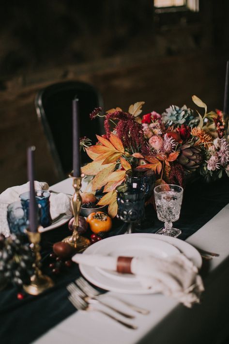 Nothing screams fall wedding décor more than colorful florals, so really make them pop with a contrasting black tablecloth and deep purple candlesticks. This reception centerpiece arrangement includes a variety of bold hues and textures. Rock N Roll Wedding, Rock Wedding, Fall Wedding Centerpieces, Fall Table Settings, Autumn Table, Moody Wedding, Winter Wedding Inspiration, Fall Wedding Decorations, Retro Wedding