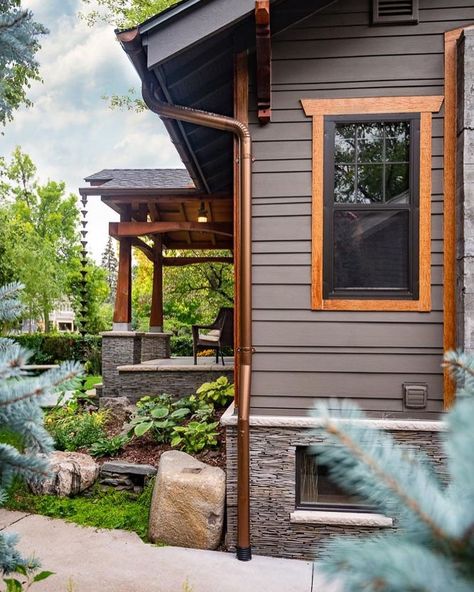 Copper Siding Exterior, Black Exterior With Copper Accents, Copper Trim Exterior, Cedar Window Awnings, Cedar Trimmed Windows Exterior, Houses With Copper Roofs, Exterior Cedar Siding, Black And Copper Exterior House, Brown Craftsman House Exterior