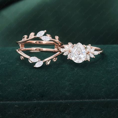 Pear Cut Moisssanite Engagement Ring sets Rose gold Engagement Ring Vintage Unique Marquise Diamond Cluster ring double curved Wedding band Please comfirm your US size when you make an order) Jewelry details: Matal Type: 14k gold /18k gold Engagement Ring: Center Stone: Moissanite Stone Size: 6*8mm Color: D-F Clarity: VVS1 Side stones: Natural and conflict-free diamonds Total weight: 0.30ctw (High Quality) Color: G-H Clarity: SI-VS Or Side Stone:Moissanite Wedding band Stone: Natural and conflic Botanical Engagement Ring, Unique Engagement Rings Leaf Band, Nature-inspired Moonstone Wedding Ring, Miss Agate Wedding Ring Set, Vintage Wedding Cluster Ring, Pear-shaped, Vintage Pear-shaped Cluster Ring For Wedding, Fairytale Engagement Rings, Moonstone Wedding Ring, Engagement Ring Vintage Unique