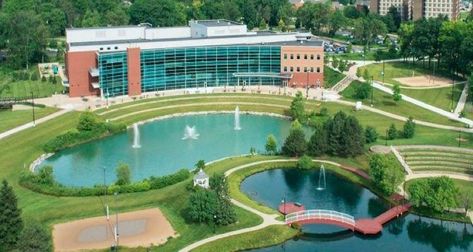 Ever since it was first revealed in 2006, the EMU Student Center has become an incredible center to the campus life at Eastern Michigan University | Ypsilanti, MI Cheerleading Pyramids, Campus Landscape, Landscaping Quotes, Blue Wedding Centerpieces, Eastern Michigan University, Buckeye Nation, Eastern Michigan, Michigan University, Student Center