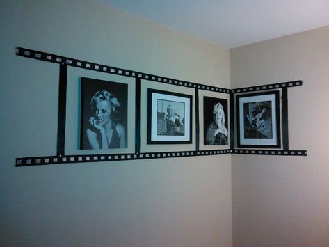 Photo reel collage made with black and white ribbon and a few of my fav Marilyn Monroe picture frames... Gives an amazing look in my living room next to my other collections! Filmmaker Room Ideas, Movie Theme Decor Room Ideas, Marilyn Monroe Living Room Ideas, Cinema Themed Living Room, Marilyn Monroe Aesthetic Bedroom, Hollywood Room Ideas, Movie Themed Living Room Ideas, Marilyn Monroe Home Decor, Film Themed Room