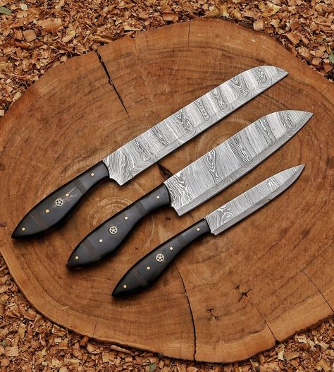 Kitchen knife set | Custom Forged chef Knives Set| cutlery set | Chef gift | Anniversary gift | Arham Cutlery This kitchen knife set is Perfect for Anniversary gift, Easter Gift, Chef gift, camping, kitchen knife, Chef knife boy scouts, the outdoors, kayaking, boating, backpacking, canoeing, or anything for the outdoors! Knife Details: Knife Materials: Blade Material: Hand forged amascus steel Handle Material: Bull horn with wengi wood spacers Handmade Leather carry bag is Included Knife... Camping Kitchen, Kitchen Knife Set, Chef Knives, Bull Horns, Chef Knife Set, Chef Gifts, Knife Set Kitchen, Cool Knives, Handmade Knives