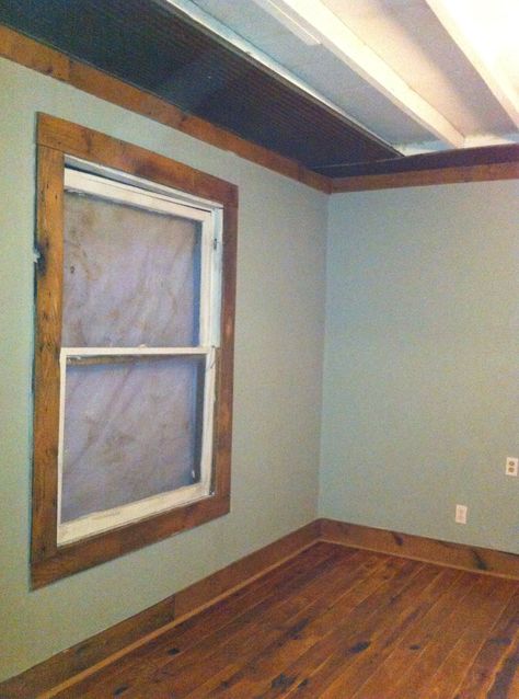 Base board and ceiling trim are barnwood. I left the rafters exposed and laid OSB on top in the attic. I used barn tin around the perimeter on the ceiling. Simple Wood Window Trim, Pallet Window Trim, Wood Trimmed Windows, Wood Ceiling Trim, Rustic Window Trim, Wolf Bedroom, Wood Window Trim, Window Trims, Modern Baseboards