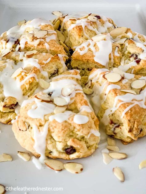 This recipe for sweet Cranberry Almond Scones is made with cream for the best, most tender scone! Just mix together 5 simple ingredients and they are ready in 20 min. Serve with sliced almonds on top or use your favorite extract for the yummy icing to drizzle over them. #scones #cranberryscones #almondscones #cranberryalmond #homemadescones Almond Scones Recipe, 3 Ingredient Biscuits, Almond Scones, Homemade Glaze, Cranberry Orange Scones, Cranberry Scones, Scones Recipe Easy, Homemade Scones, Afternoon Tea Recipes