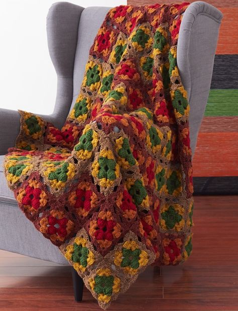 Imagine for a minute that moment in the height of the fall season when the last of the trees have changed their colors, creating a wall of glorious colors glowing from their branches. This crochet afghan will help you capture a bit of that magic within your hook and yarn. The Autumn's Calling Crochet Afghan uses a unique granny square motif in an array of your favorite fall colors. Free Afghan Patterns, Thanksgiving Crochet, Crochet Afghan Blanket, Granny Blanket, Autumn Crochet, Crocheted Afghans, Granny Square Patterns, Fall Crochet Patterns, Crochet Afghan Patterns