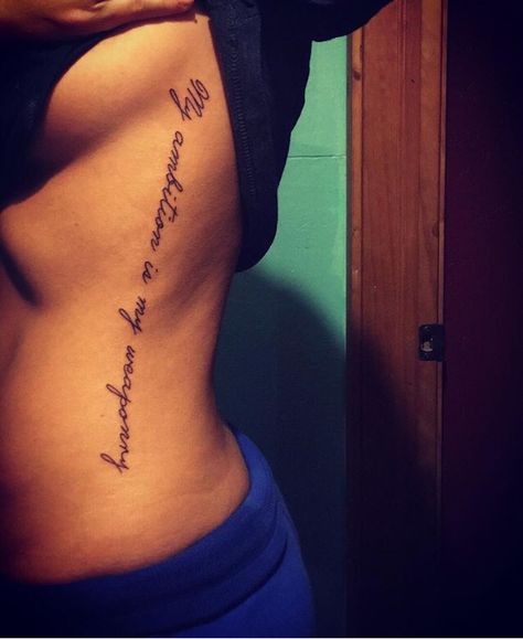 Side tattoo. My ambition is my weaponry. Script Side Tattoos Women, Side Tattoos Women Ribs Meaningful, Side Tattoos Women Ribs, Rib Tattoo Quotes, Quote Tattoo Ideas, Side Tattoos Women, Side Thigh Tattoos, Rib Tattoos For Women, Waist Tattoos