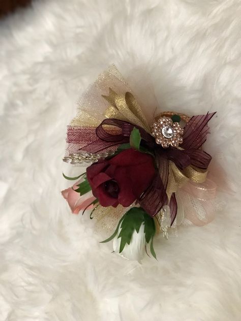 Wrist corsage burgundy rose gold Prom Corsage And Boutonniere Burgundy, Corsages For Prom Burgundy, Maroon And Gold Corsage, Dark Red Corsage, Hoco Corsage, Red And Silver Corsage, Corsage Burgundy, Girl Prom, Wedding Corsages