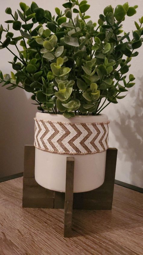 Plant stand with jenga blocks Jenga Lantern Diy, Jenga Block Plant Stand, Jenga Blocks Diy, Jenga Block Crafts Diy Dollar Tree Candle Holders, Diy Outdoor Jenga Set, Diy Tumbling Tower Blocks Crafts, Dollar Tree Tumbling Tower Blocks Diy, Gnome Accessories, Plant Holder Diy