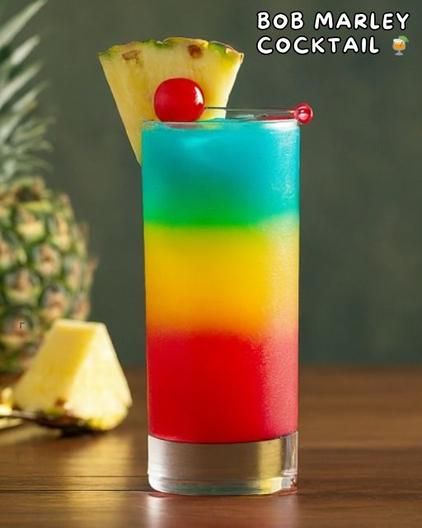 Bob Marley Cocktail: A Colorful, Tropical, and Refreshing Drink - RecipeStrip Bob Marley Cocktail, Bob Marley Drink Recipe, Bob Marley Drink, Uno Birthday, Pineapple Benefits, Colorful Drinks, Light Rum, Rum Drinks, Drinks Alcohol