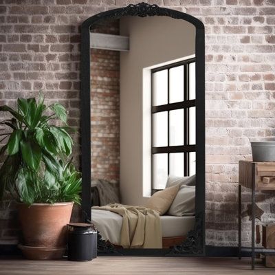 Open up your entryway or add some dimension to your bedroom wall with this classic standing floor mirror. Available in three sizes to choose from, this piece is framed in solid wood with a neutral finish, and it's accented on the top with a decorative floral-inspired inlay. We love how the arched top gives it a traditional silhouette that complements your French country decor. Plus, it has a double backing that helps it stay in place. Something to keep in mind: From what we've heard, this mirror Large Floor Length Mirror, Large Floor Mirror In Living Room, Floor Length Mirror Bedroom, Floor Mirror In Bedroom, Modern Farmhouse Mirror, Dinning Room Flooring, Full Length Mirror Decor Ideas, Bedroom Planning, Black Floor Mirror