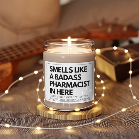 Looking for a funny pharmacist gift? This Smells Like A Badass Pharmacist candle is for you!  Perfect for both  women and male pharmacist for a graduation gift, birthday, Christmas, Valentine's Day, Mother's Day, Father's Day, appreciation, or thank you gift. Packed with immersive aromas, these scented candles come in 9oz glass jars and are one size (2.8″ × 3.5") (7.1cm × 8.8cm).  Made with 100% natural soy wax blend, each candle features a 100% cotton wick and a permanent adhesive label. .: Materials: 100% natural soy wax blend, 100% cotton wick and a glass jar .: One size: 2.8″ × 3.5" (7.1cm × 8.9cm) .: Burning time: 50-60 hours .: Glossy permanent adhesive label .: Choose from five different aromatic scents .: All scents have the same wax color Pharmacist Gift Ideas, Graduation Pharmacy, Pharmd Graduation, Pharmacy Graduation Gift, Pharmacy Week, Pharmacy Graduation, Graduation Gift Basket, Pharm D, Pharmacy Art