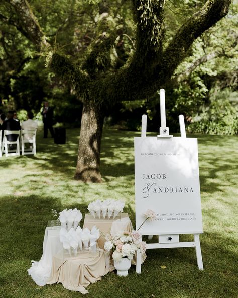 That petal toss moment after you say ‘I do’ is so iconic! We offer petal stations that sit perfectly next to your welcome sign to greet guests as they enter your ceremony space. The cones come in lots of 25- so you can choose how many you think you’ll need! Or maybe you don’t need any cones! You just want a big ol’ basket of delicate petals that guests can grab from- we can do that too! We can clean up the beautiful mess afterwards too 😉 Photography by @anelloweddings ✨ Petal Station Wedding, Pedal Toss Wedding, Petals Down The Aisle, Petal Toss Wedding, Petal Toss, Your Welcome, Wedding Petals, Wedding 2025, Beautiful Mess