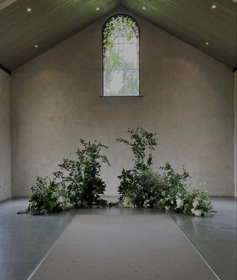 Minimal Flower Arch Wedding, Grounded Greenery Arch, Greenery Ceremony Backdrop, Greenery Altar Arrangement, Floor Ceremony Flowers, Floor Alter Flowers, Unique Ceremony Florals, Ground Arch Wedding Ceremony, Unique Ceremony Seating