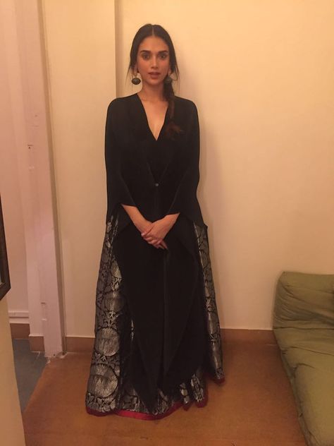 Aditi Rao Hydari wearing a limited edition black brocade lehenga with a pleated black poncho Brocade Lehenga, Diwali Dresses, Aditi Rao Hydari, Aditi Rao, Black Poncho, Indian Bridal Dress, Blouse Design Models, Indian Attire, Indian Designer Wear