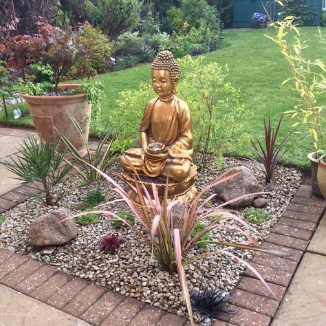 From shabby to chic, the boring gravelled area of our patio turned into a tranquil haven with a Buddha water feature, plants and rocks, very happy with how it looks now. Buddha Garden Ideas, Feature Lights, Water Feature Lighting, Golden Buddha Statue, Garden Conservatory, Beautiful Gardens Landscape, Small Japanese Garden, Japanese Garden Landscape, Buddha Garden