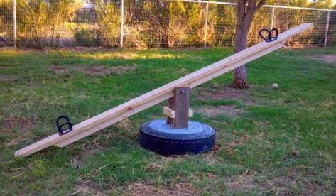 DIY Teeter Totter / Seesaw From Old Recycled Tire - TeeDiddlyDee Diy Teeter Totter, Daycare Toys, Tire Playground, Diy Kids Playground, Tire Chairs, Playground Landscaping, Reuse Old Tires, Kids Backyard, Teeter Totter