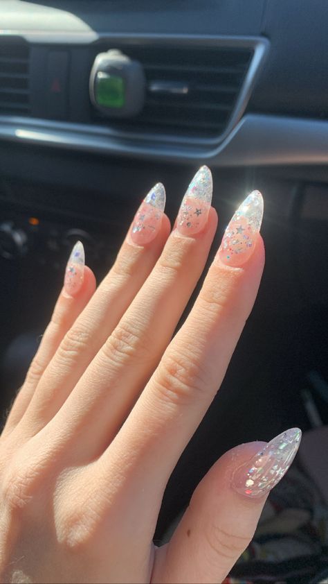 Nice Sparkly Nails, Clear Sparkle Almond Nails, Clear And Glitter Acrylic Nails, Clear Glittery Acrylic Nails, White Almond Nails With Design Glitter, Silver Sparkly Nails Almond, Clear Glittery Nails, Birthday Nails Almond Glitter, Clear Nails Almond