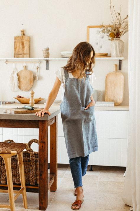 camille styles in casa zuma linen apron. Dinner For A Crowd, Crossback Apron, Wood Salad Bowls, Table Throw, Artist Outfit, Handcrafted Ceramics, Handcrafted Wood, Linen Apron, Tongs